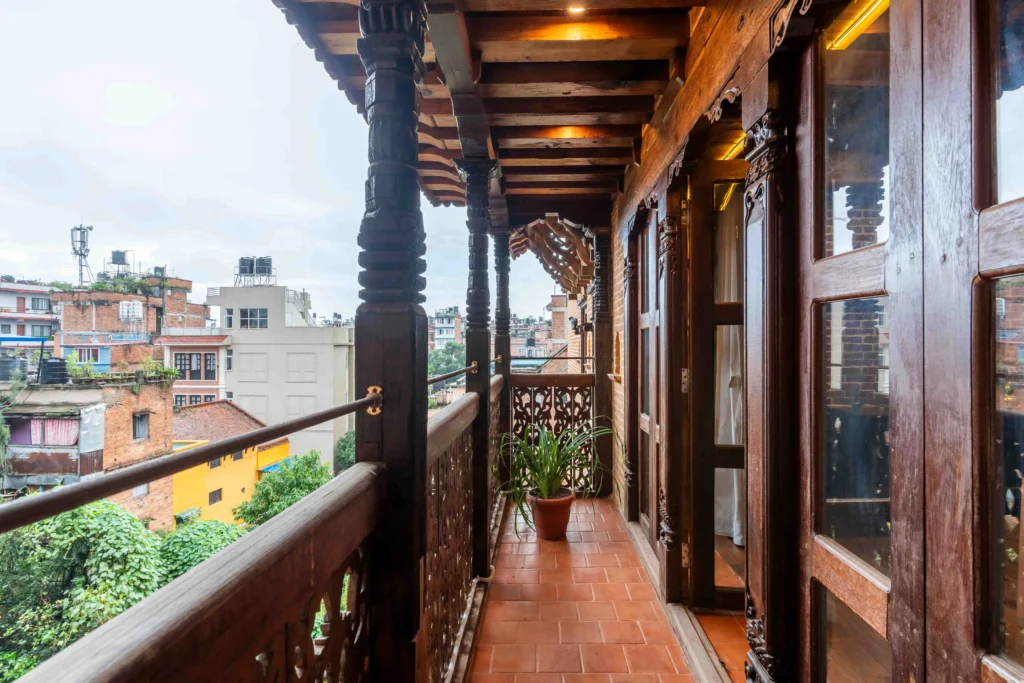 Balcony of a hotel room designed using traditional heritage concept and detailing.