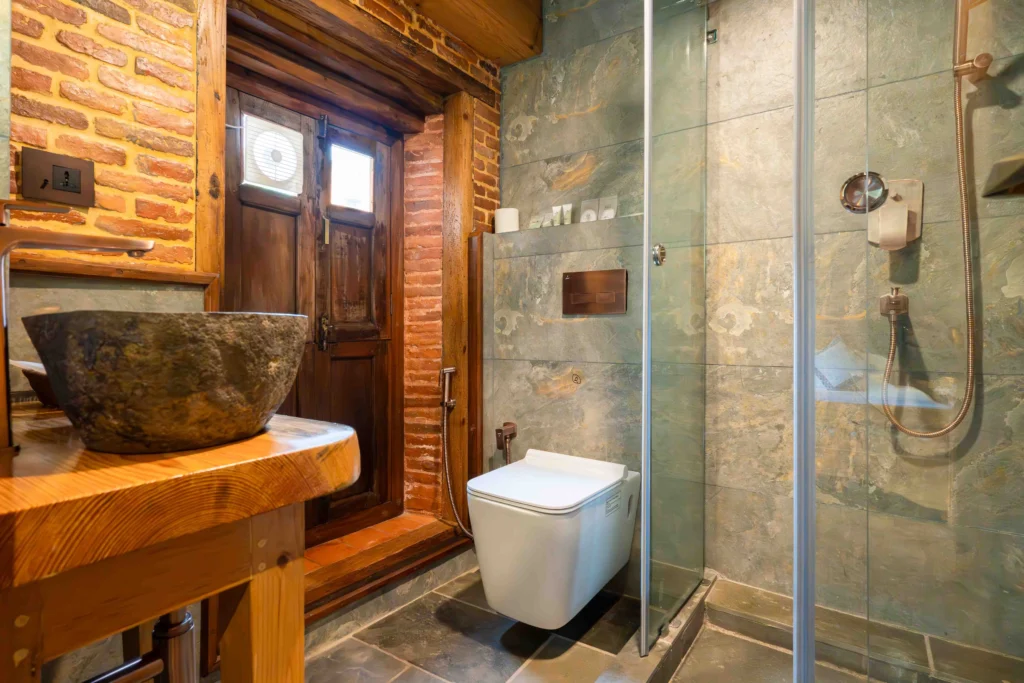 Bathroom of a hotel room designed traditionally.