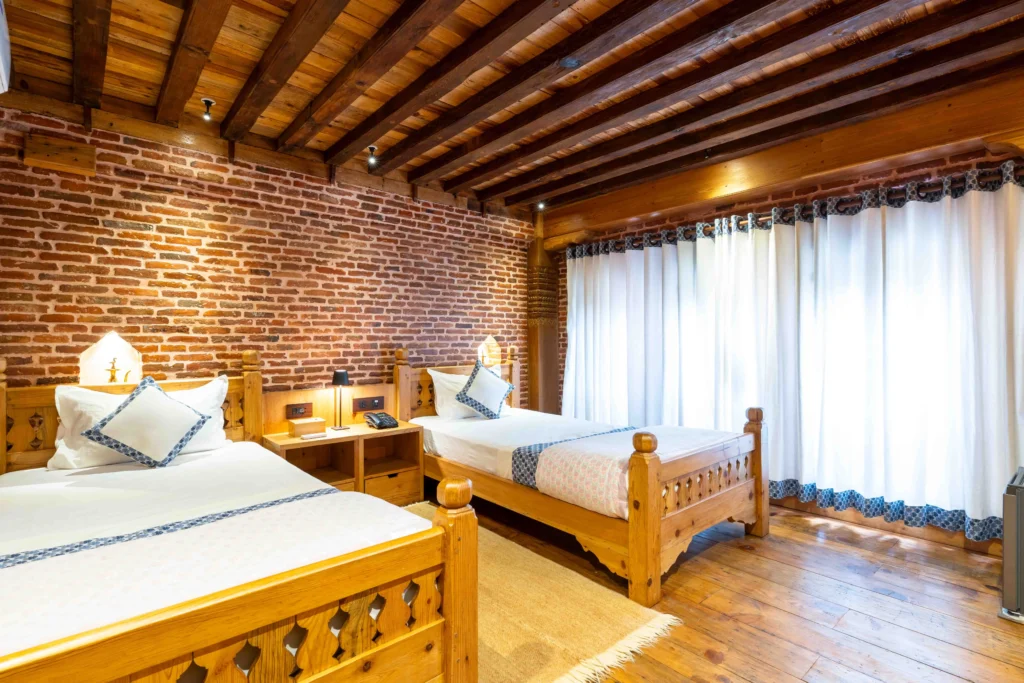 Nepali heritage themed hotel room at Lalitpur along with other hotel amenities.